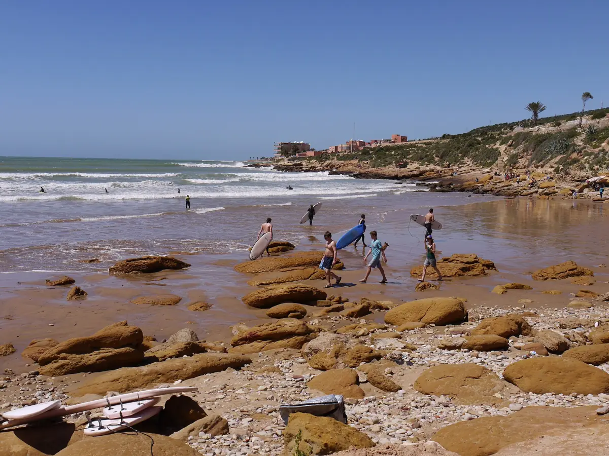 The beach at Taghazout with surfers